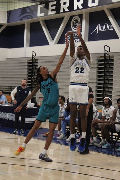 #22 Ade Daramola shoots for three