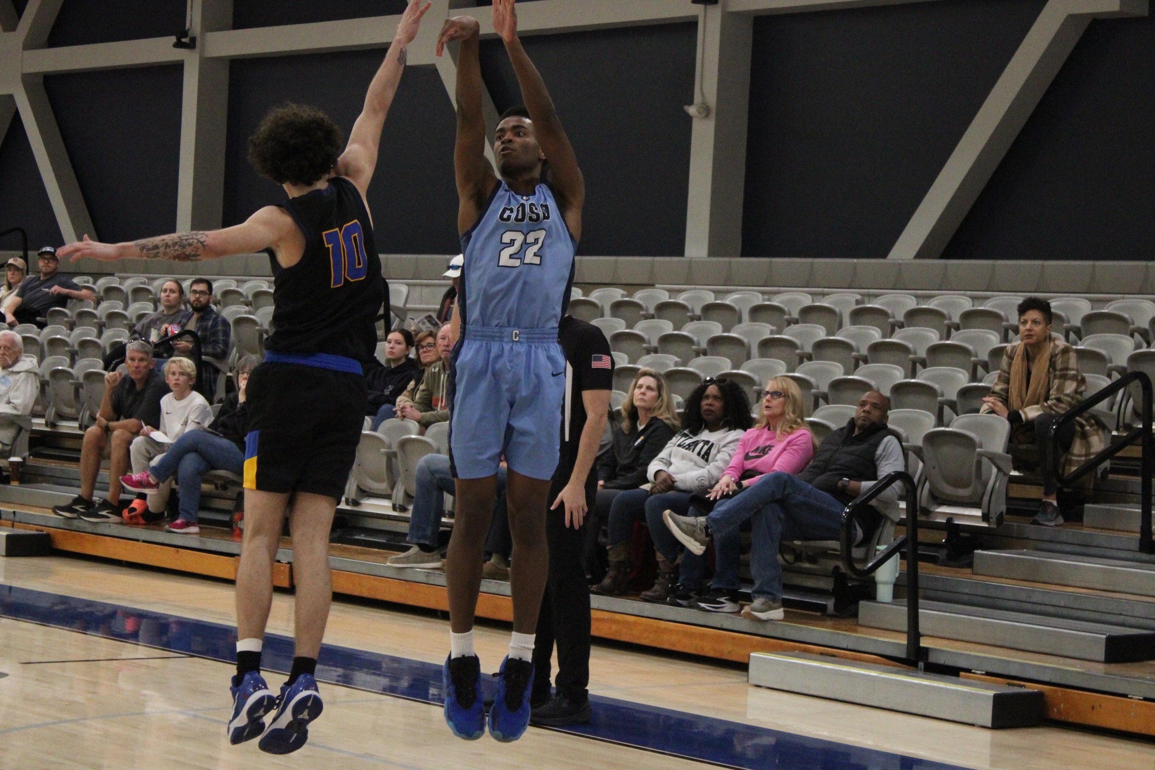 #22 Ade Daramola drains a 3 pointer