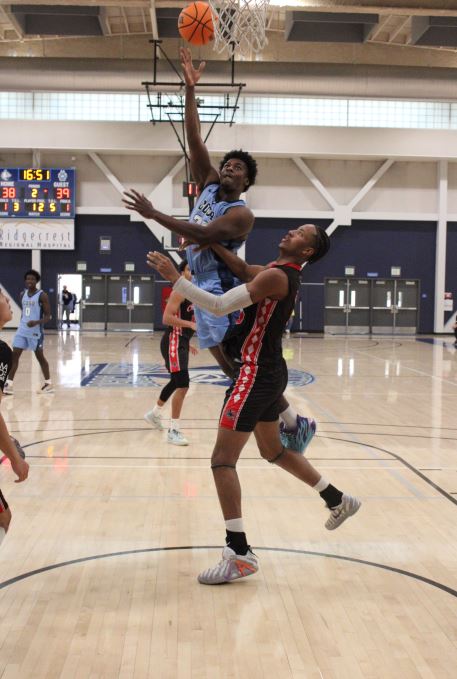 Issiakoi Aminou drives the basket

